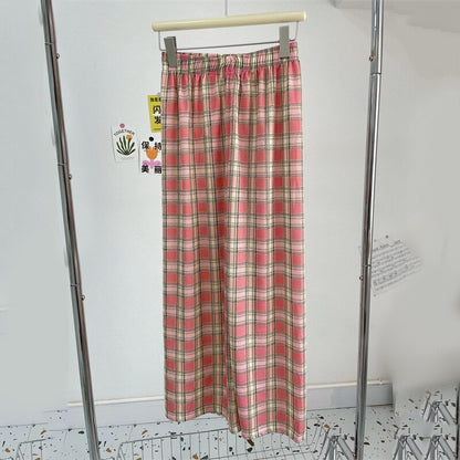 Spodnie Paola - Damskie spodnie w kratę z wysokim stanem zapewniające modny, swobodny wygląd.