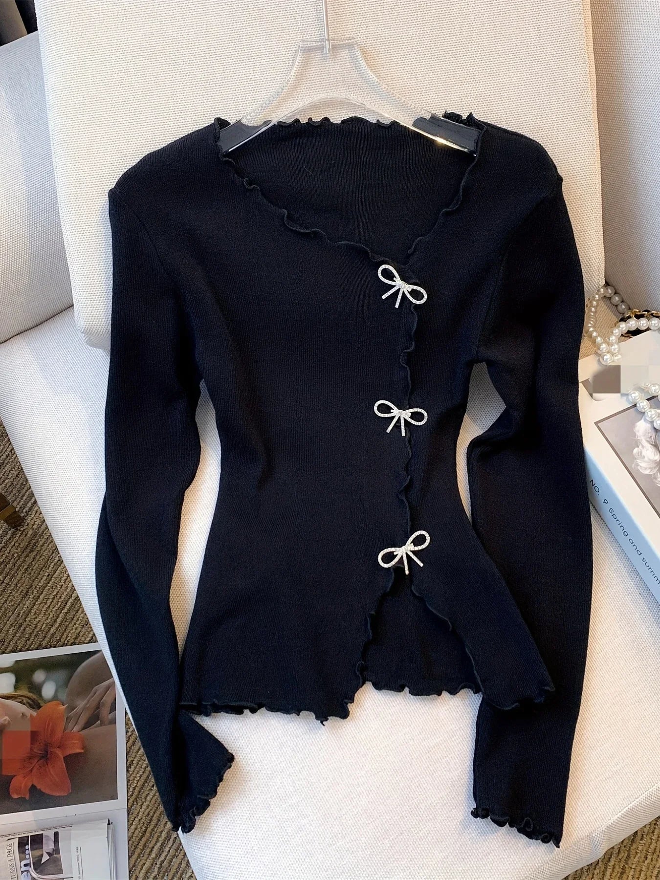 Sweter z kokardą dla kobiet