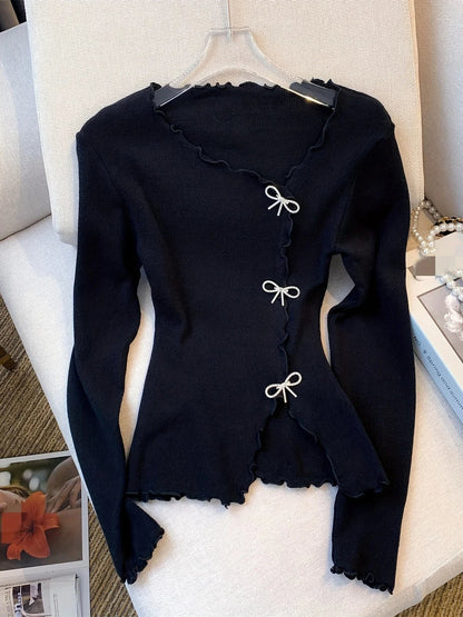 Sweter z kokardą dla kobiet